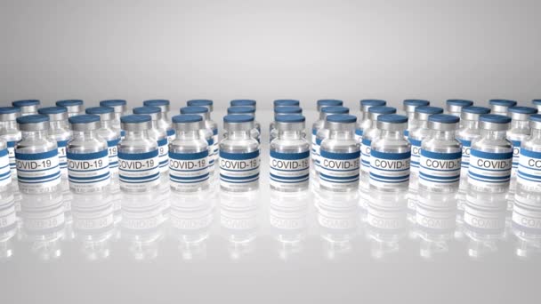 Şişe koronavirüs aşısı COVID-19. İçinde sars-cov-2 aşısı olan cam şişeler. pürüzsüz 3d döngü oluşturucu — Stok video