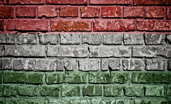Hungary flag painted on old brick wall