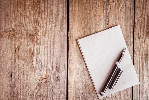 Paper and pen on wooden background — Stock Photo, Image