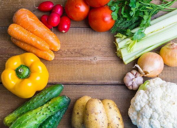 Vegetable frame on wooden background