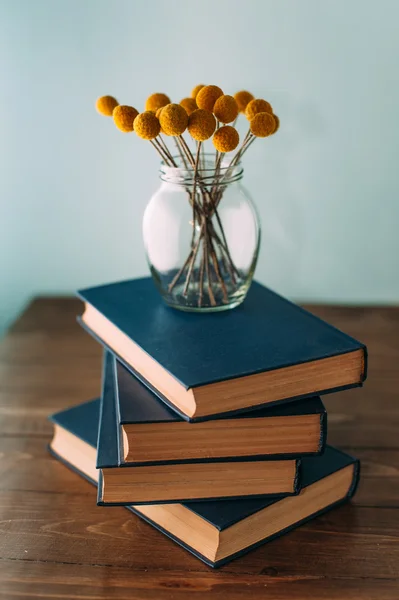 Stack of books and flowers — Stock Photo, Image