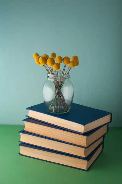 Stack of books and flowers — Stock Photo, Image