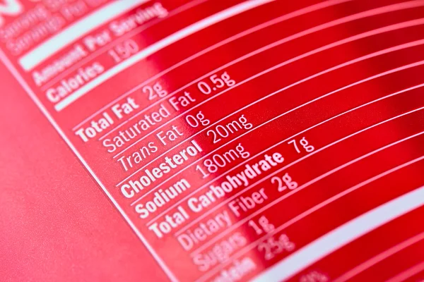 Inscriptions sur bouteille de nutrition sportive en plastique rouge — Photo