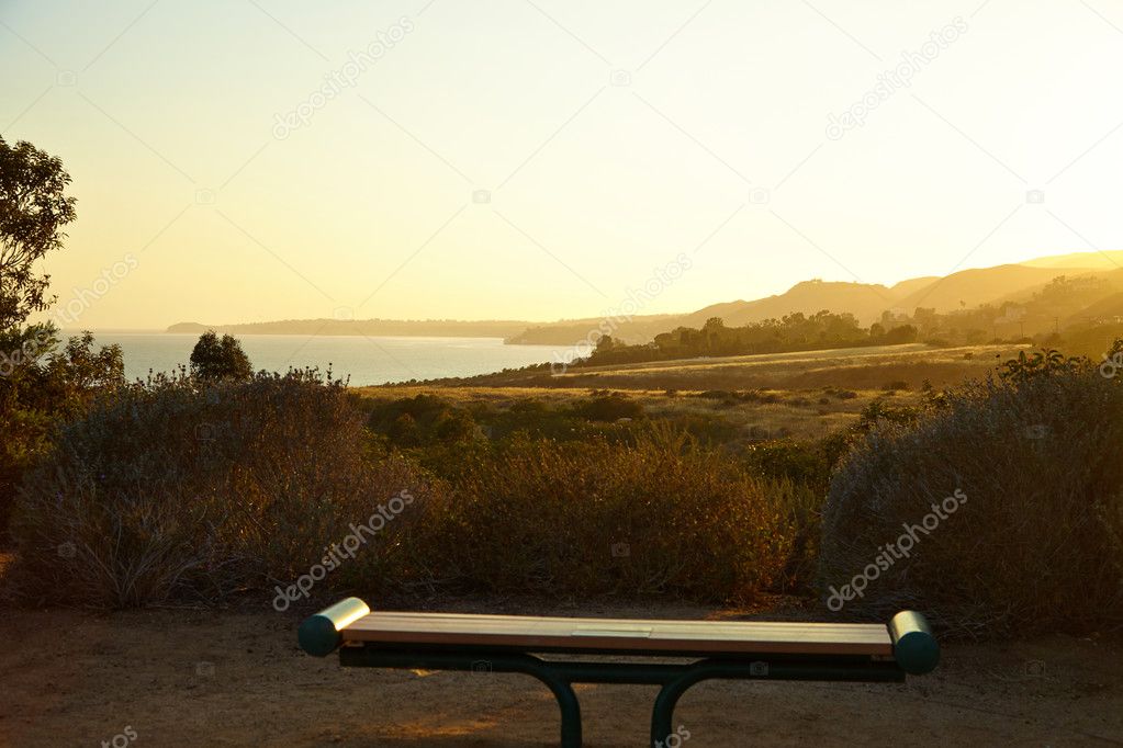 Bench on a hill near the ocean