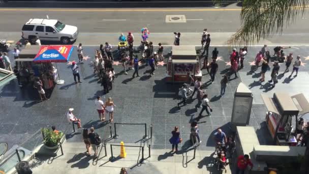 LOS ANGELES - September 2016: Hollywood Walk of Fame with people walking by. — Stock Video