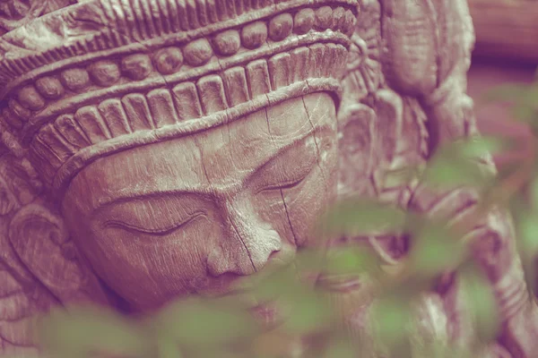 The wood buddha in leaves — Stock Photo, Image