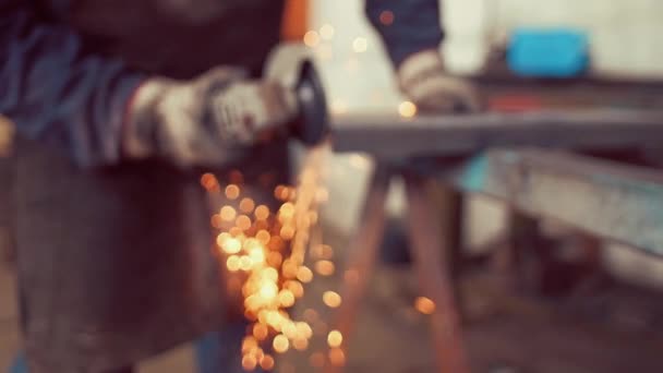 Slow motion shot of Metal worker grinding in factory — Stock Video