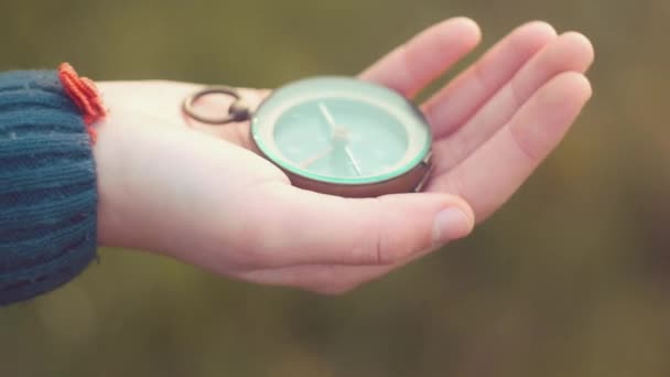 Teenager girl  holding an old compass in hand