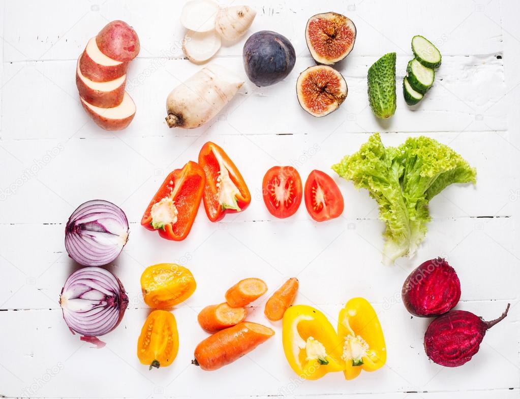 Colorful various of organic farm vegetables on wooden rustic background top view