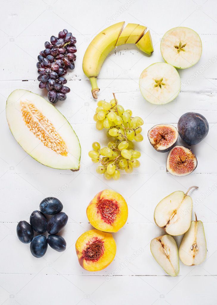 Colorful various of organic fruit on wooden rustic background top view