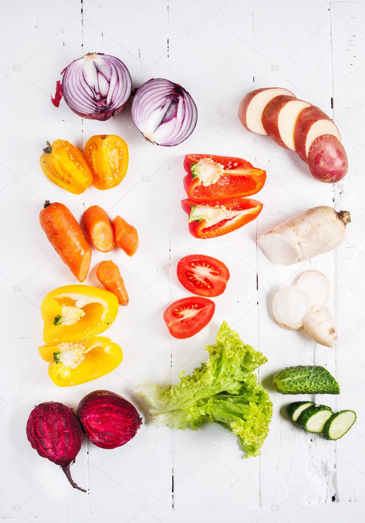 Colorful various of organic farm vegetables on wooden rustic background top view