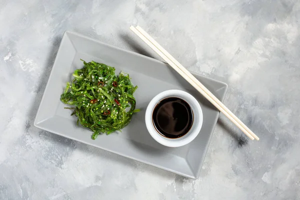 Wakame Seaweed Salad Sesame Seeds Chili Pepper Bowl Concrete Background — Stock Photo, Image