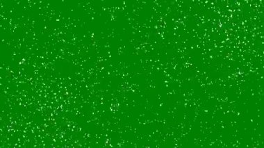 Hızlı dönen beyaz kar veya yeşil zemin üzerinde parçacıklar. Havadaki dinamik rüzgar parçacıkları. Kaotik hareket. Tasarım animasyonu, kroma anahtarı. 4K.