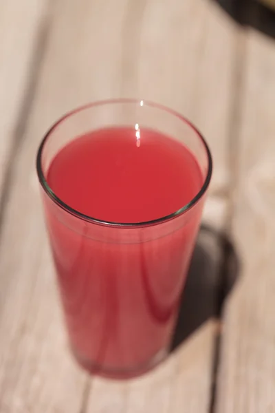 Pink glass of red watermelon fruit juice — Stock Photo, Image