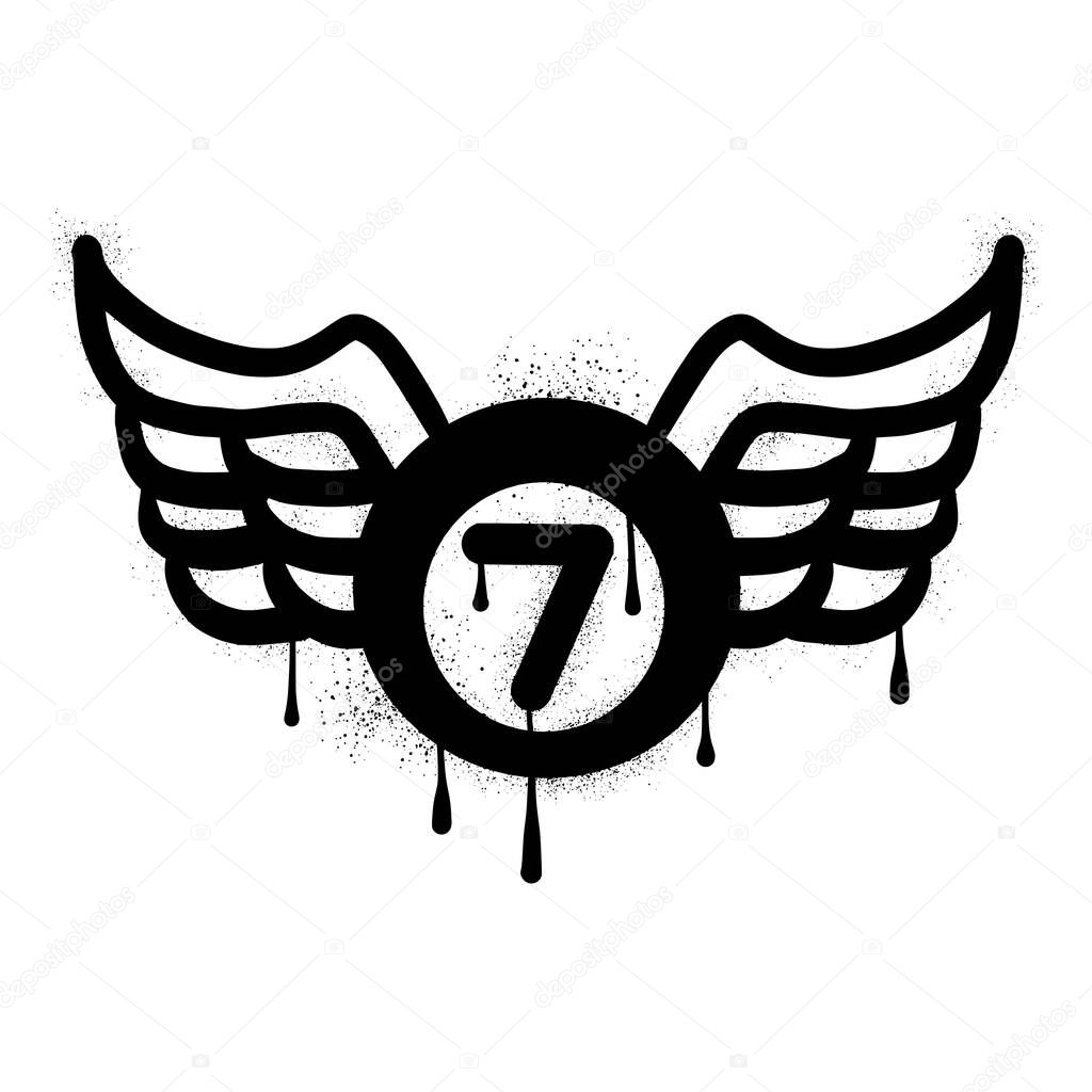 Billiard ball wings drawn in black spray paint graffiti style