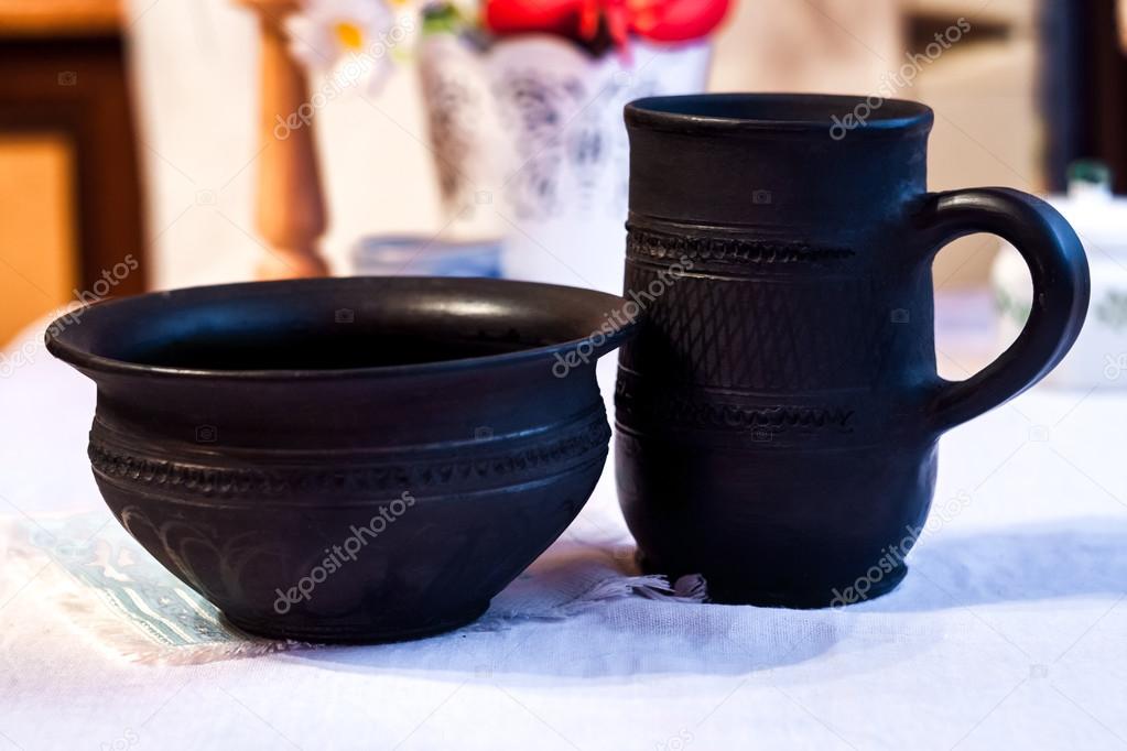 Jug and cup of black clay