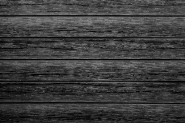 Black wooden wall texture for background.