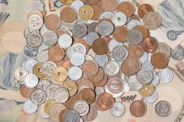 Ιαπωνικό γιεν τραπεζογραμμάτια και κέρματα. έννοια των οικονομικών. — Φωτογραφία Αρχείου