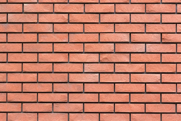 Röd tegel vägg struktur för bakgrund. Stockbild