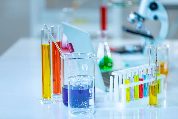 Laboratory Research - Scientific Glassware For Chemical Background with different chemical color.
