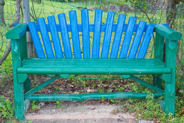 Multicolored bench in the park — Stock Photo, Image