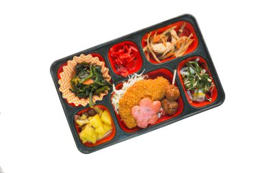 Wh izole bir kutu içinde balık börek ve diğer Japonya Mama seti