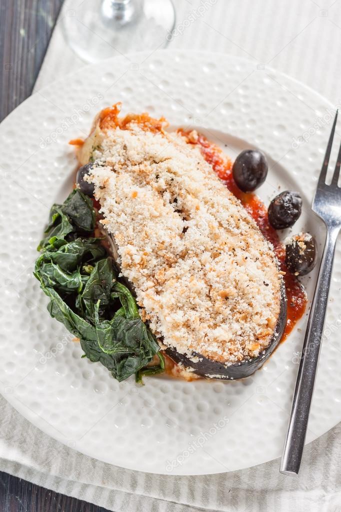 Salmon with breadcrumbs, olives and spinach Stock Photo by ©Seagull_l