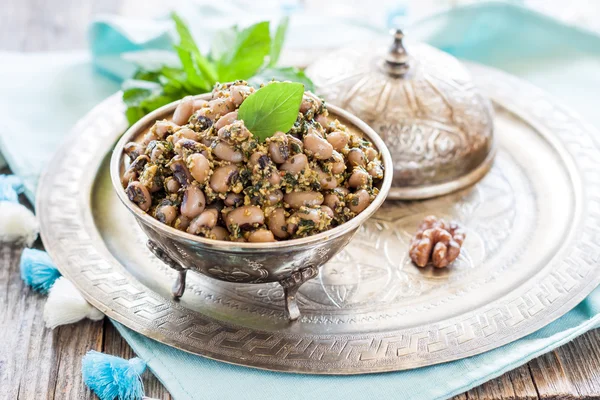 Lobio. Beans with walnuts, garlic and herbs. — Stock Photo, Image