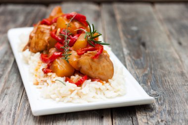 Chicken with pineapple in sweet and sour sauce clipart