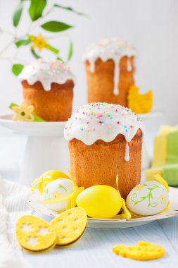 Easter cakes and colored eggs clipart