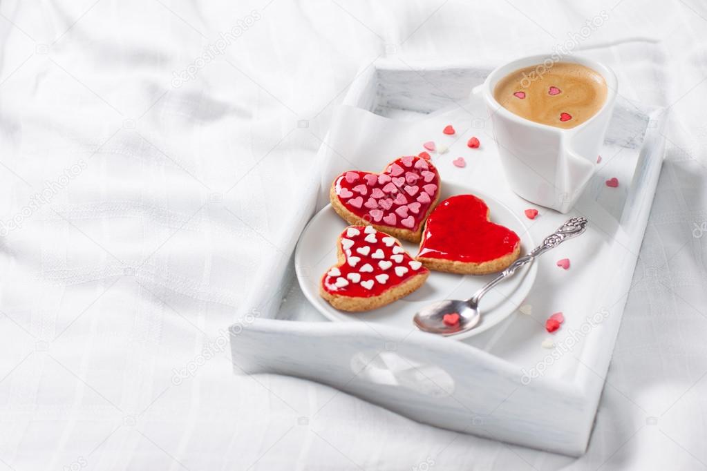 cup of coffee and heart biscuits