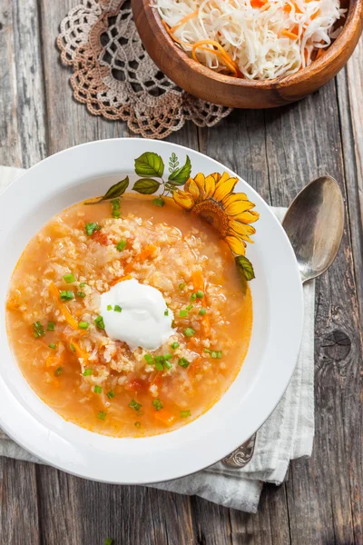 Soup with sauerkraut and millet. Russian kitchen. rustic style — Stock Image Soup with sauerkraut and millet. Russian kitchen. rustic style Stock Picture