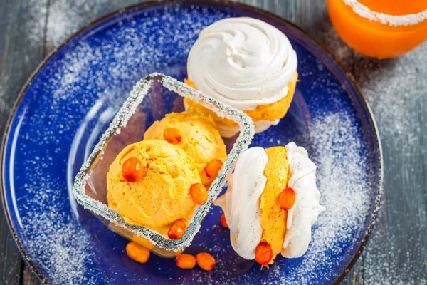 Meringue with ice cream of sea buckthorn — Stok fotoğraf