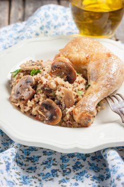 Quinoa with mushrooms and fried chicken leg