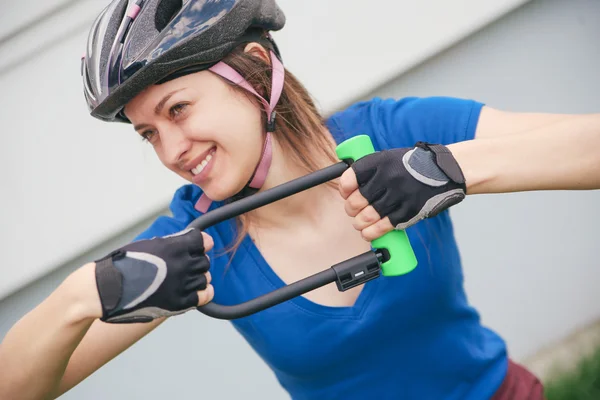 Girl with bicycle  lock — Stock Photo, Image