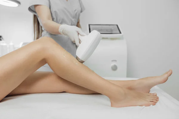 Woman has a laser epilation and cosmetology procedure — Stock Photo, Image