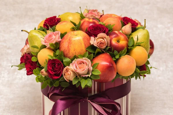 Gift floral fruit bouquet on light background close up
