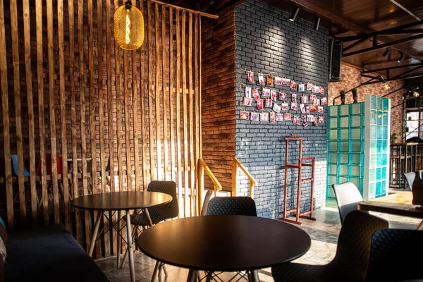 The interior of an urban cafe with a stylish design during the day.