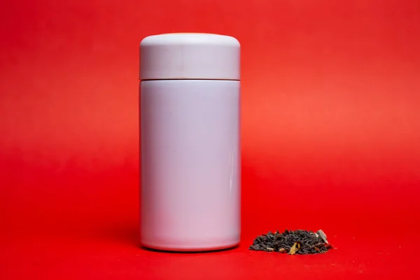 White Thermos Green Leaf Tea Red Background — Stock Photo, Image