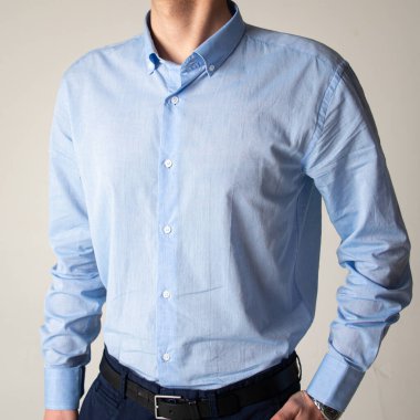 Guy in a blue classic shirt on a white background