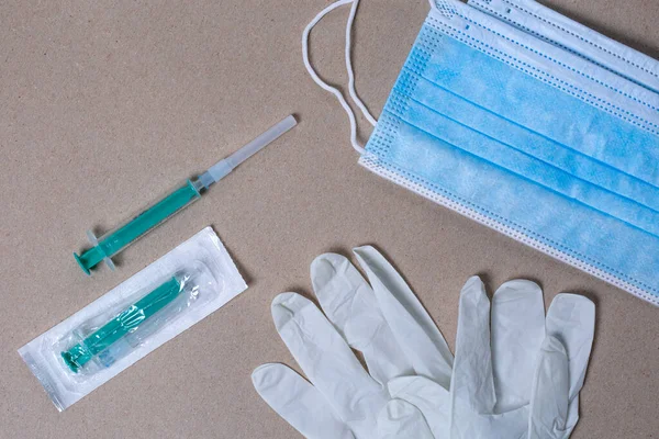 stock image photo with medical objects, mask, syringe and gloves.