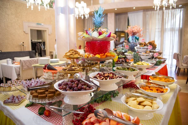 table with fruit at a buffet in the hotel on vacation.