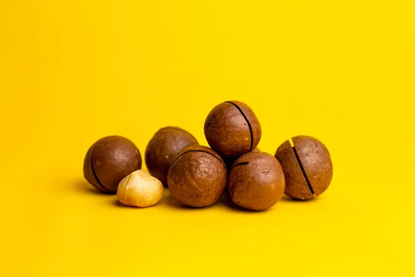 Delicious High Calorie Macadamia Nut Yellow Background — Stock Fotó