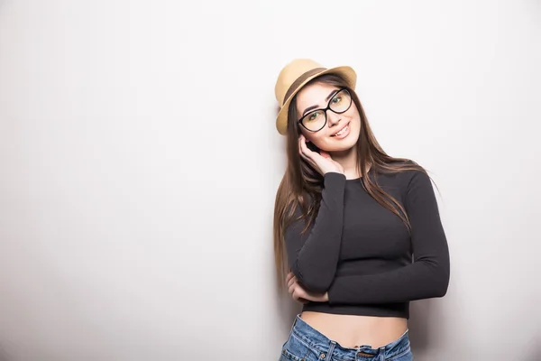 Portrait of beautiful young woman in glasses and funky hat — Stock Photo, Image