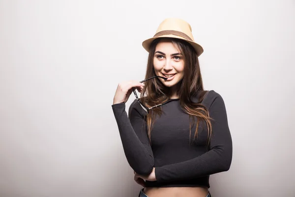 Portrait of beautiful young woman in glasses and funky hat — Stock Photo, Image