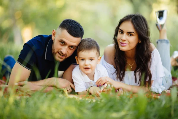 Happy family spending their time in park  on picnic — Stock Photo, Image