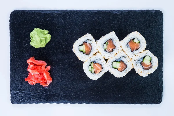 Sushi Set nigiri and sushi rolls on black stone slate. — Stock Photo, Image