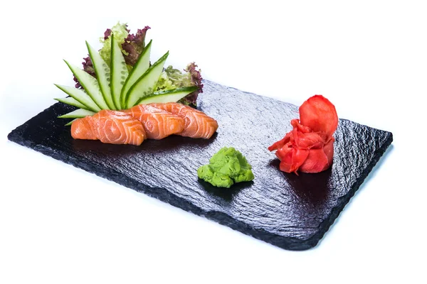 Sushi instellen en sushi rolt op zwarte stenen leisteen. — Stockfoto