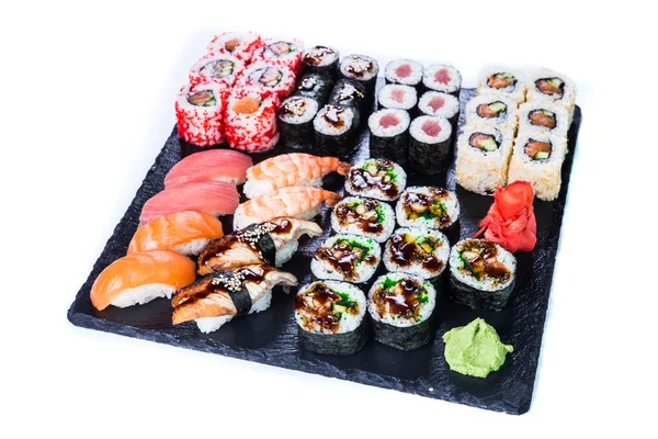 stock image Sushi Set  and sushi rolls on black stone slate.