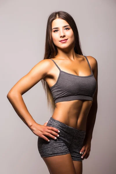 Aantrekkelijke fitness vrouw, opgeleide vrouwelijk lichaam — Stockfoto